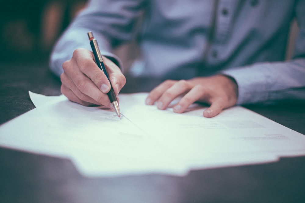 Professional contract document with clear, readable text and pen on modern desk